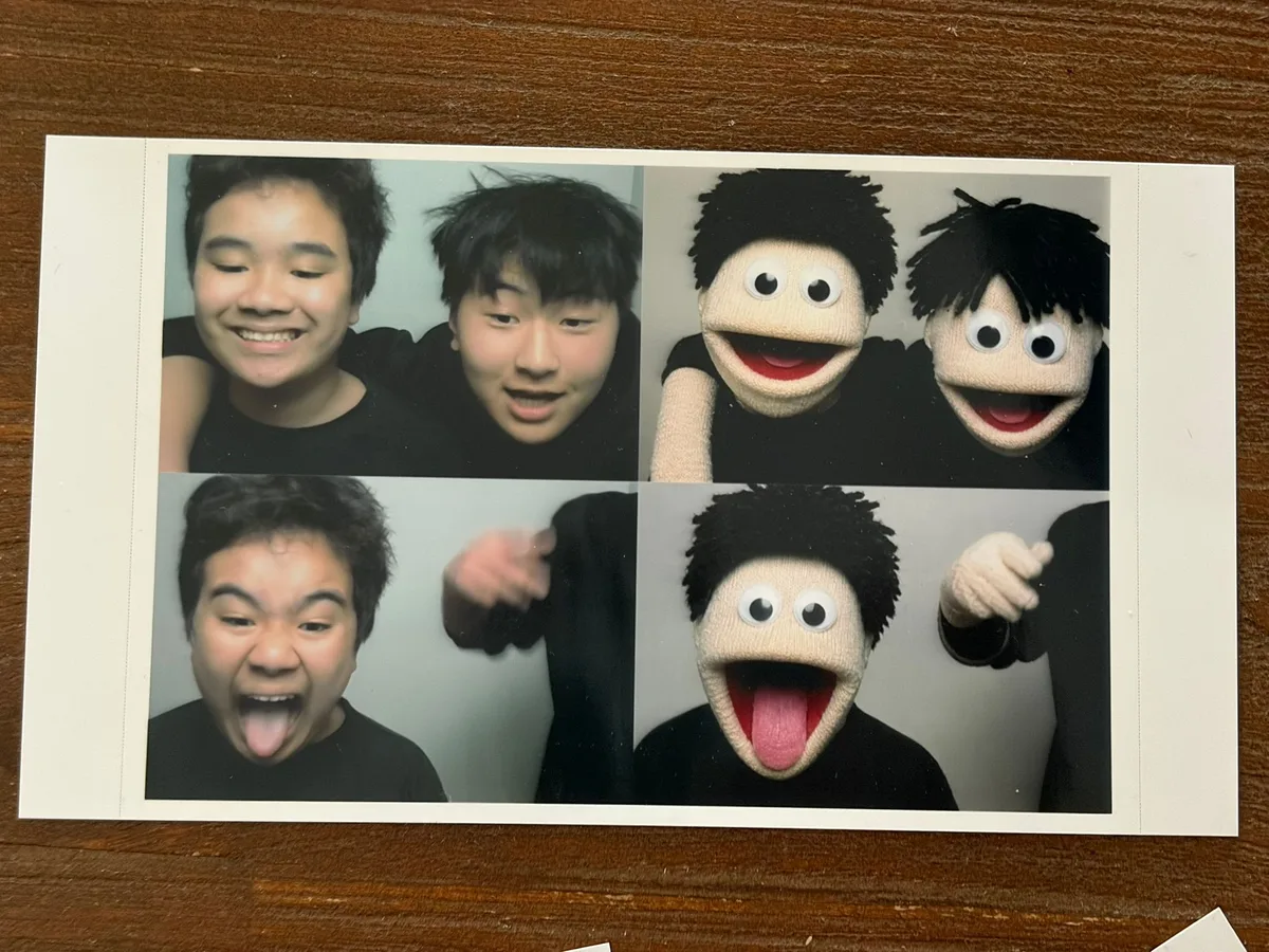 Real AI photo booth print from a Sydney event pairing guests' photos with their sock puppet AI style
